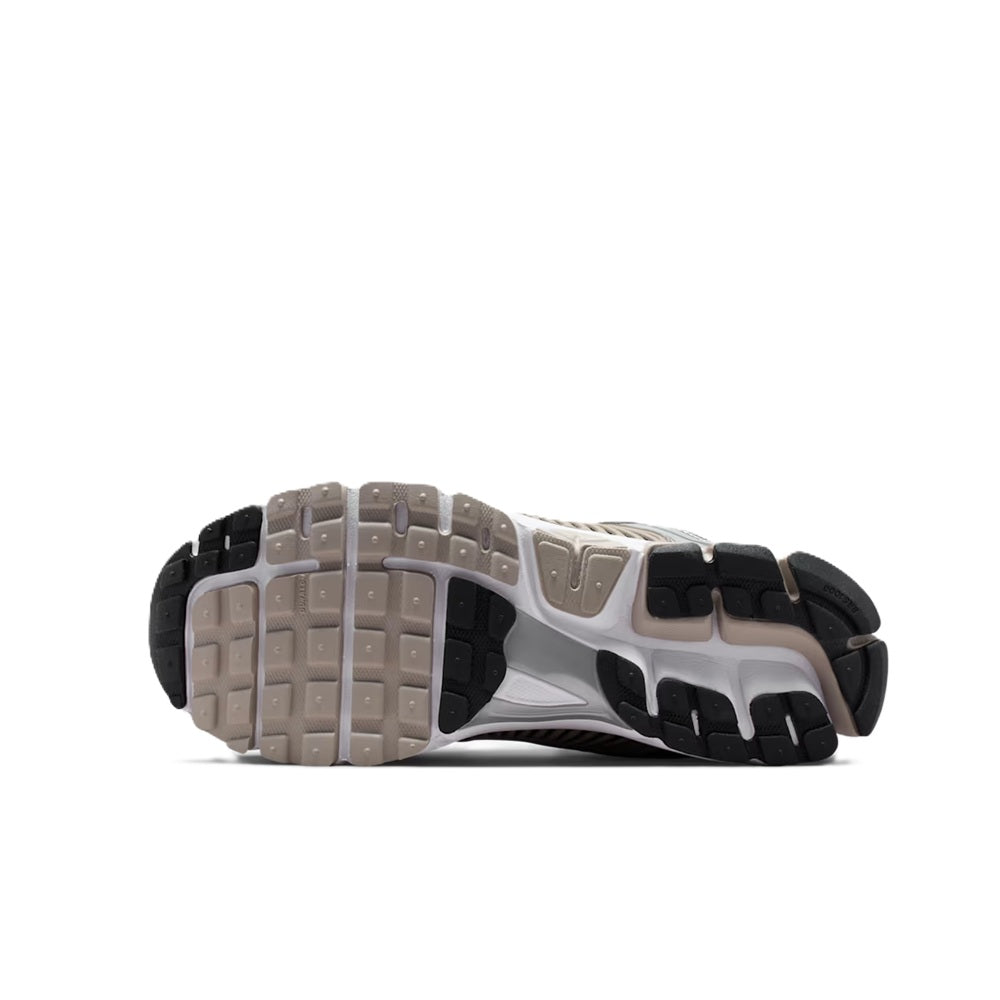 Men's Nike Zoom Vomero 5 outsole view with grey-and-black tread and cushioned midfoot