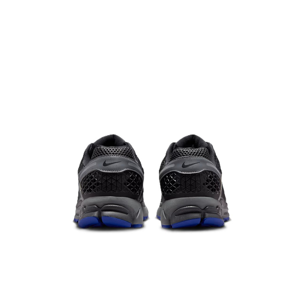 Men's Nike Zoom Vomero 5 shoes, rear view dark gray with blue heel tabs