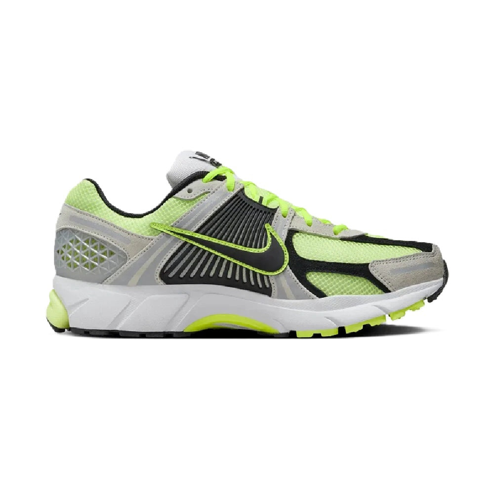 Men's running shoes side view in lime green, gray, and black; lace-up with swoosh