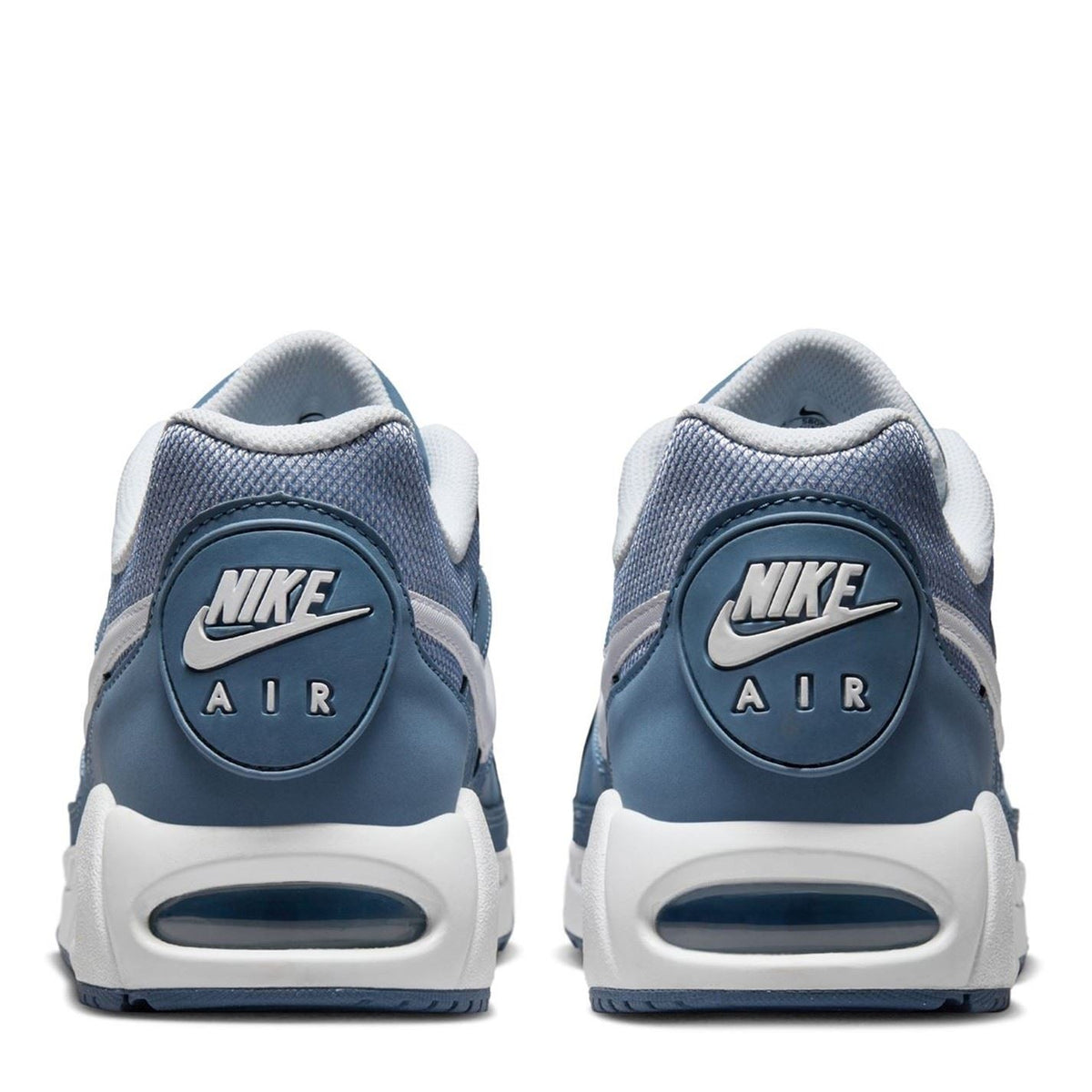 Navy blue trainers with Nike Air heel badge and white foam sole, lace-up