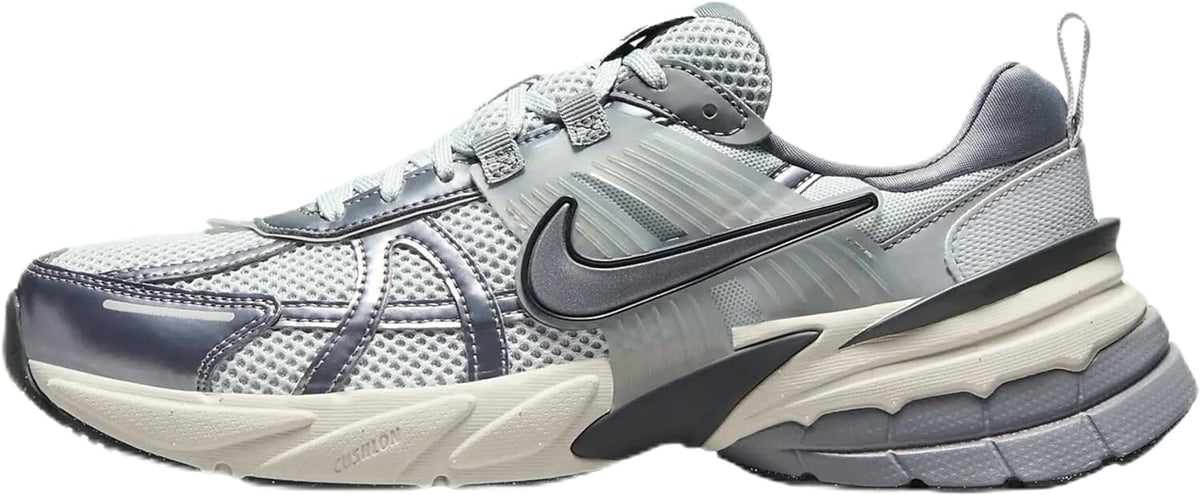 Women's Nike lace-up running shoes in light gray with black swoosh and chunky sole