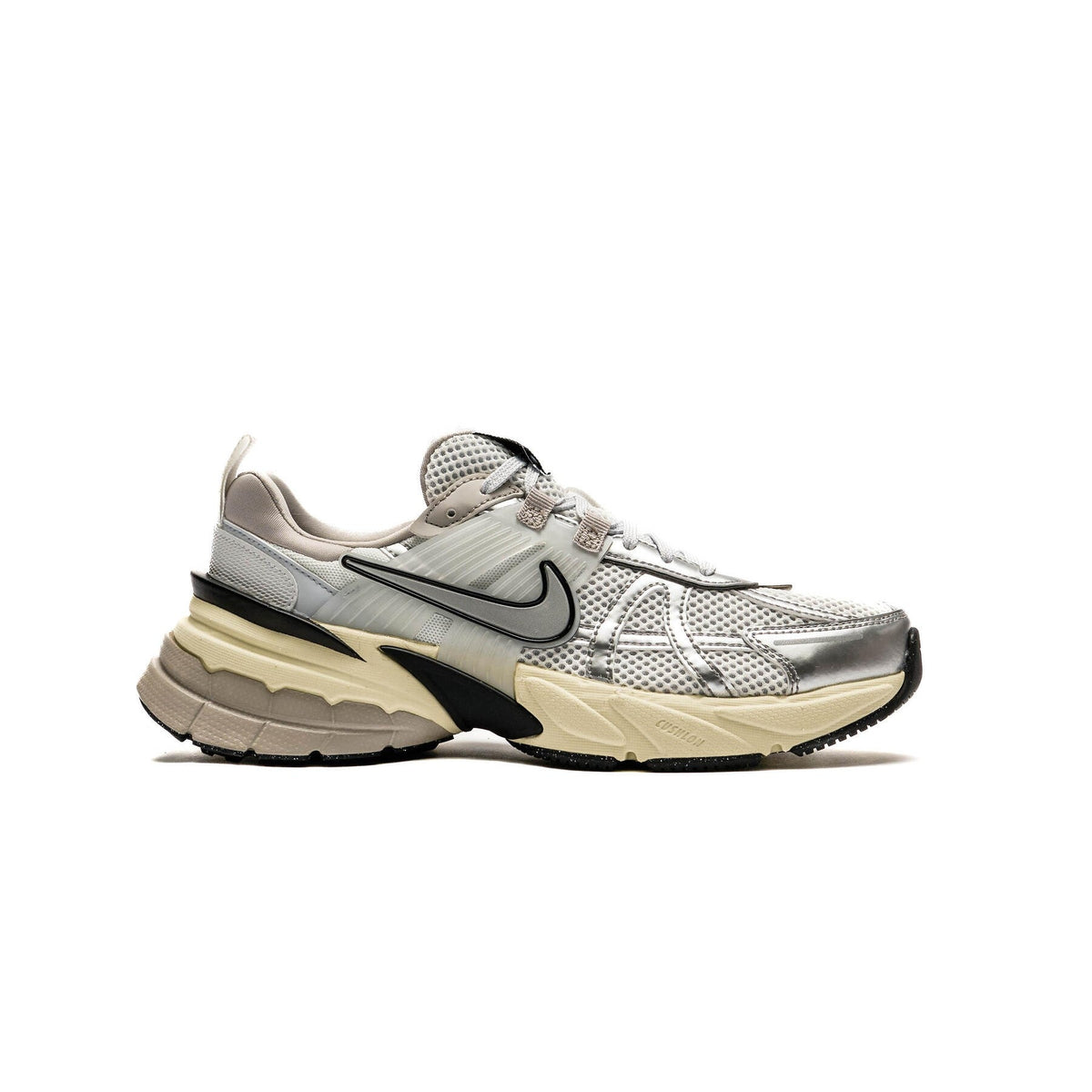 Women's Nike V2K Run sneakers in white and metallic silver with beige midsole, black logo