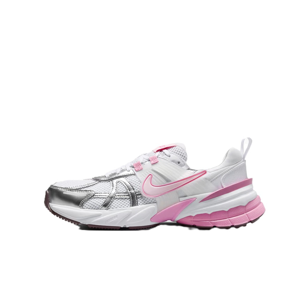 Women's Nike V2K Run sneakers, side view; white with pink trim and chunky midsole.