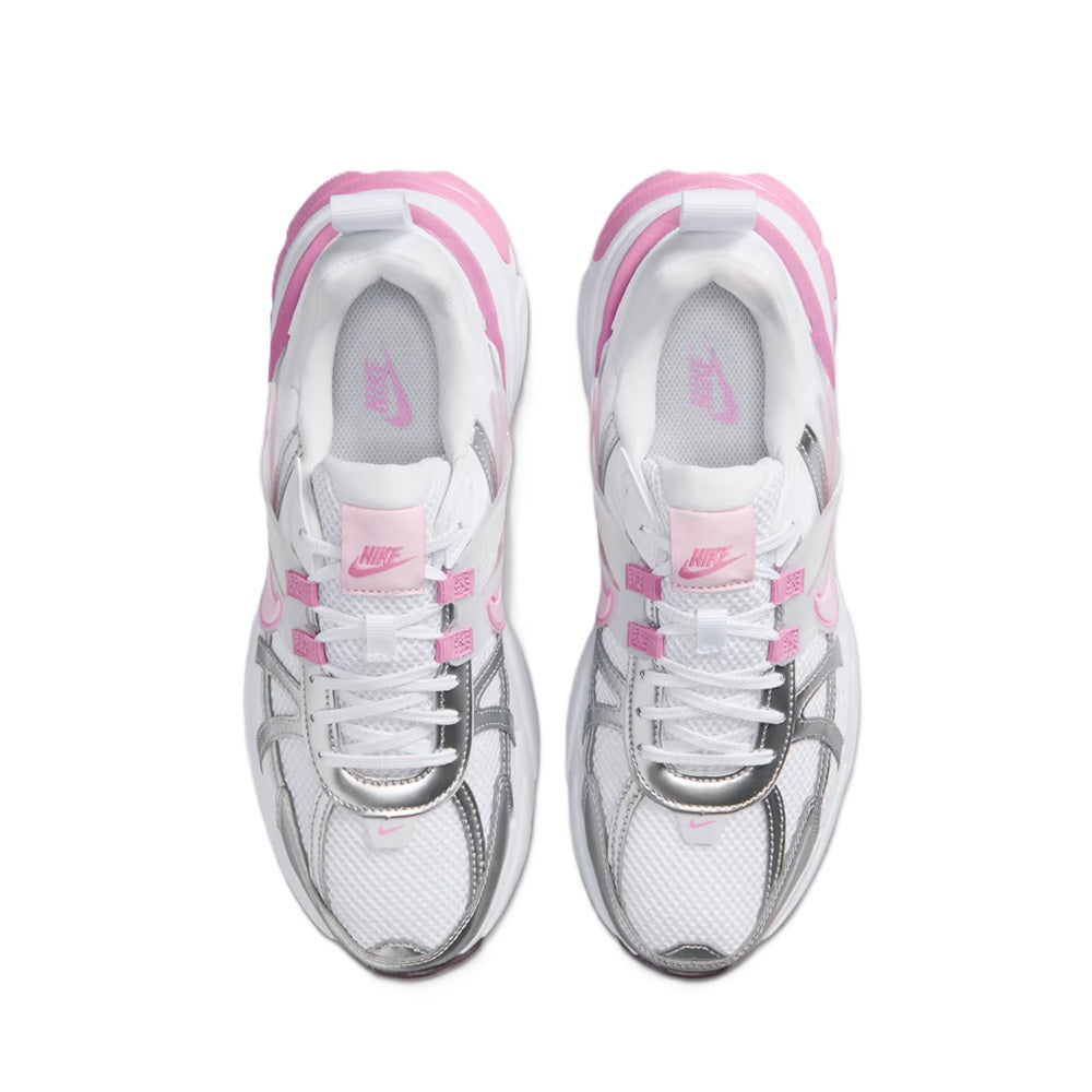 Women's Nike V2K Run sneakers, white lace-up with pink Nike logo on tongue.