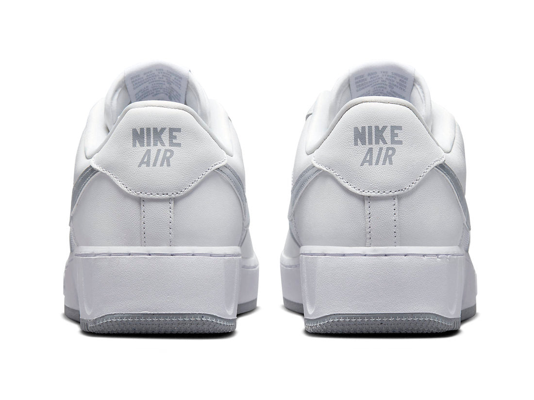 Back view of white sneakers with Nike Air heel branding and cushioned collar