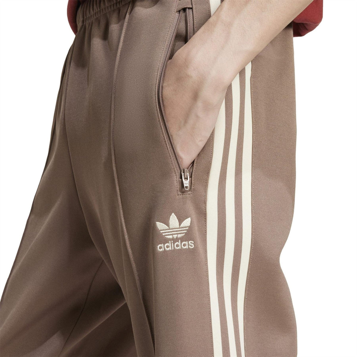 adidas Originals track pants front detail, trace brown with adidas logo and side stripe panel