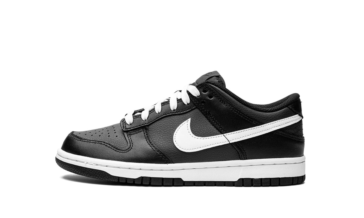 Kids' black and white low-top sneakers with white Nike swoosh