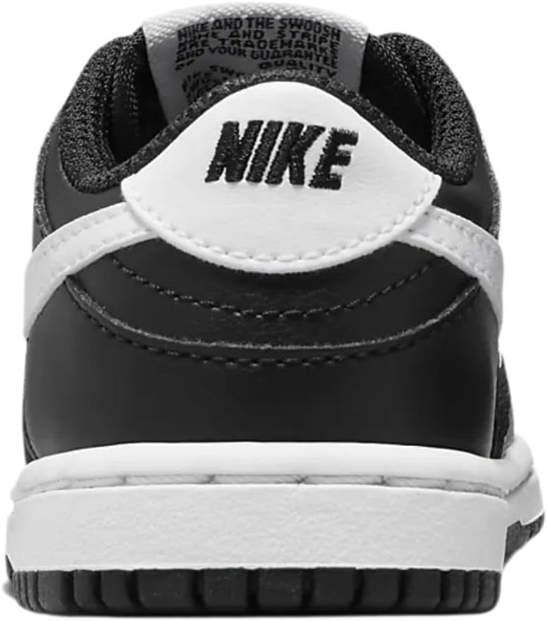 Nike toddler low-top sneakers heel view, white collar and black back with Nike logo