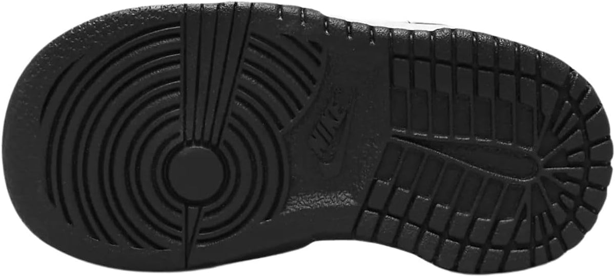Nike toddler sneaker outsole, black rubber tread with circular and grid patterns