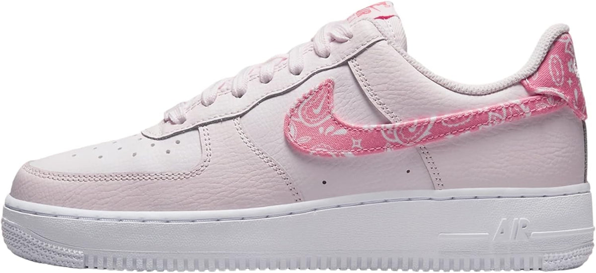 Low-top Nike Air Force 1 sneakers, pale pink with pink patterned Swoosh, white sole