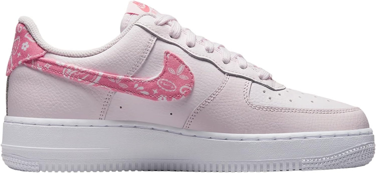 Low-top Nike Air Force 1 sneakers, pale pink upper with pink patterned Swoosh and laces