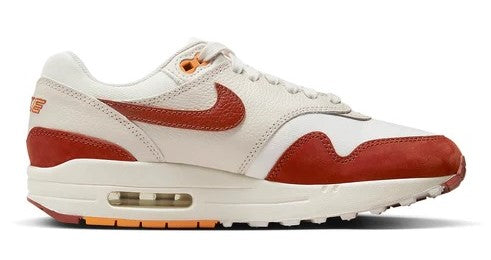 Women's Nike Air Max 1 LX sneakers, sail upper with orange swoosh and side panel waves