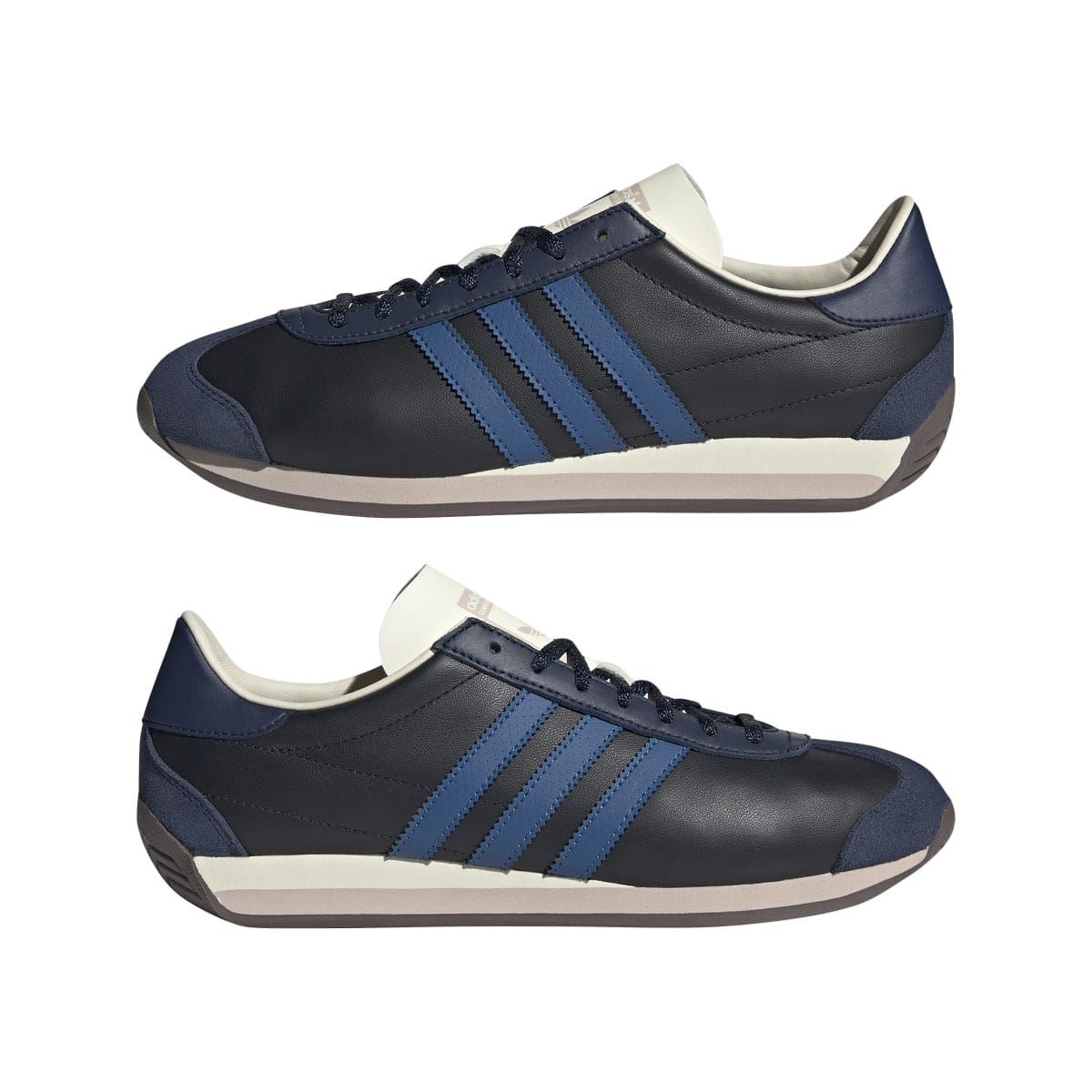 Pair of navy/black adidas trainers with blue stripes, cream details, and light rubber sole
