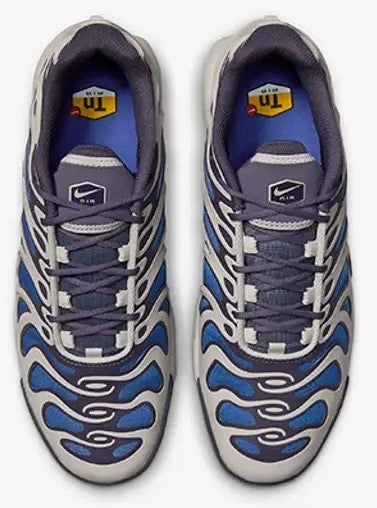 Men's Nike sneakers front view, lace-up in gray with blue flame pattern on toe