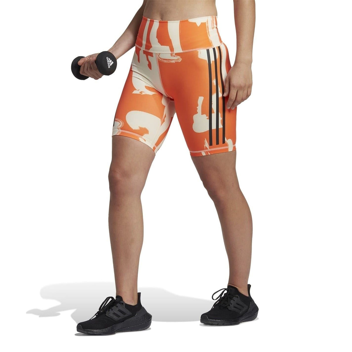 Orange and beige graphic biking shorts, snug fit with striped side detailing