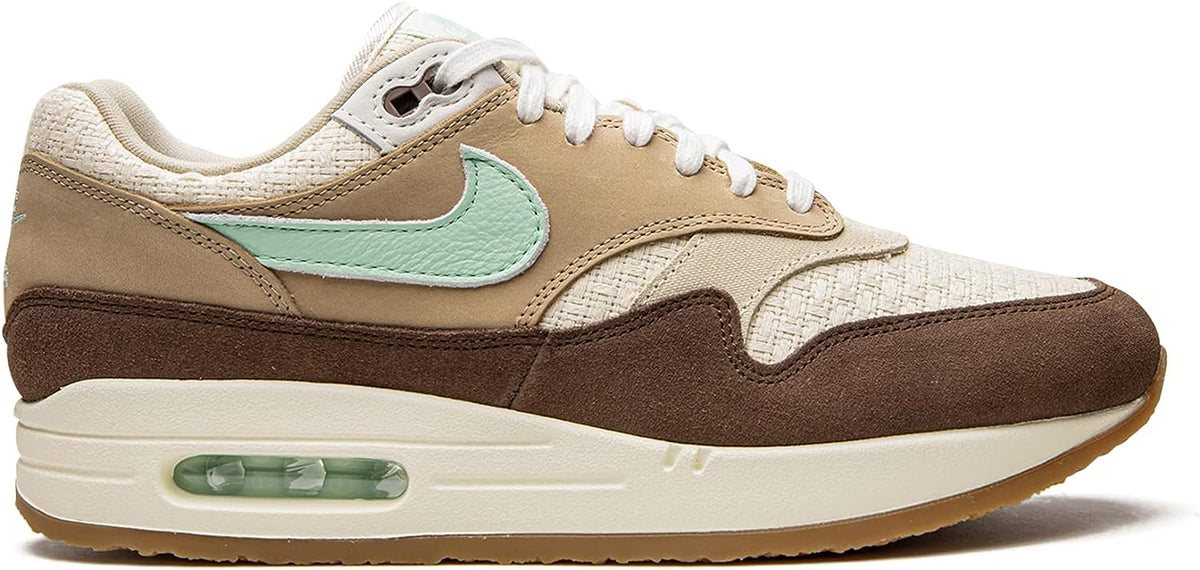 Nike Air Max 1 PRM sneaker, side view with mint Swoosh, tan upper, brown toe panel