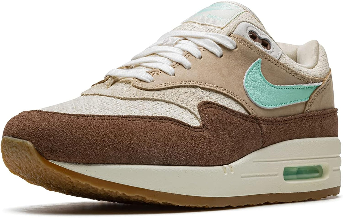 Nike Air Max 1 PRM sneaker, front 3/4 view with mint Swoosh and tan laces
