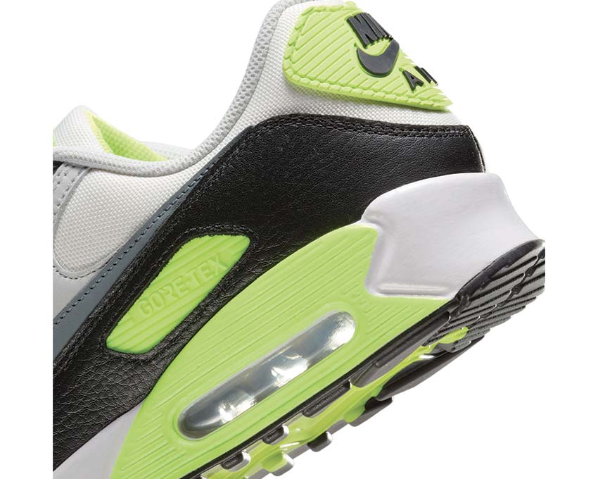 Close-up of Nike Air Max 90 GTX heel with neon green paneling, black leather and Air unit