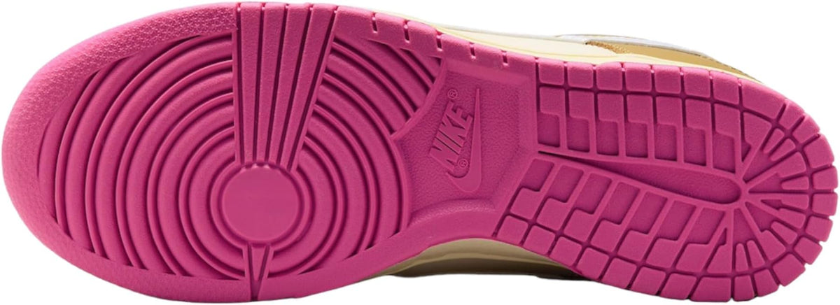 Pink rubber outsole with circular traction pattern and Nike logo on low-top sneakers
