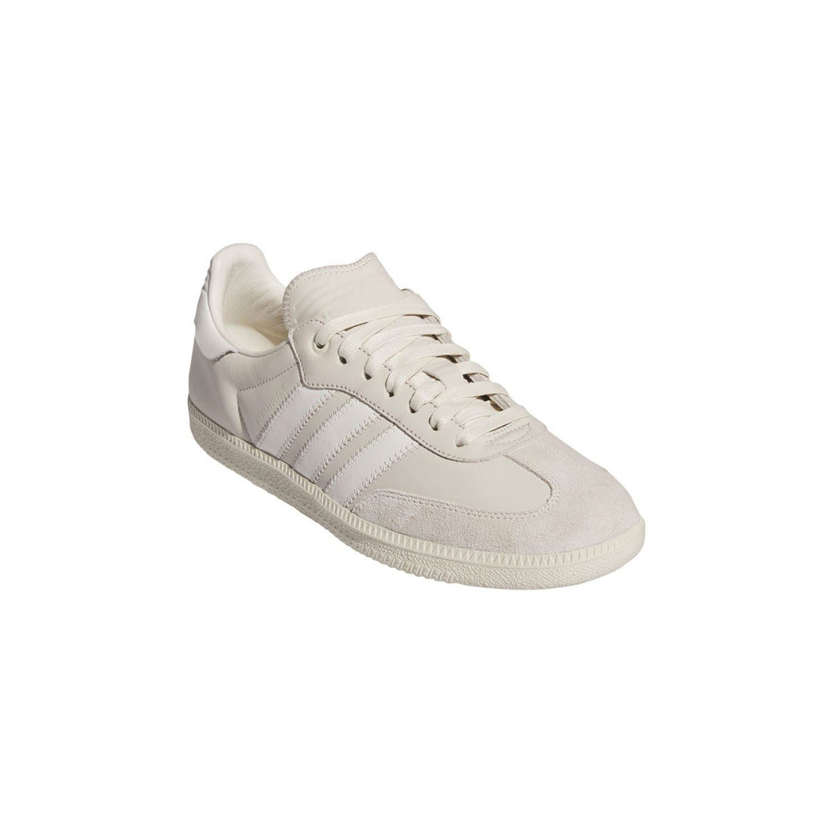 White low-top trainers with lace-up front, suede and leather panels, and striped side