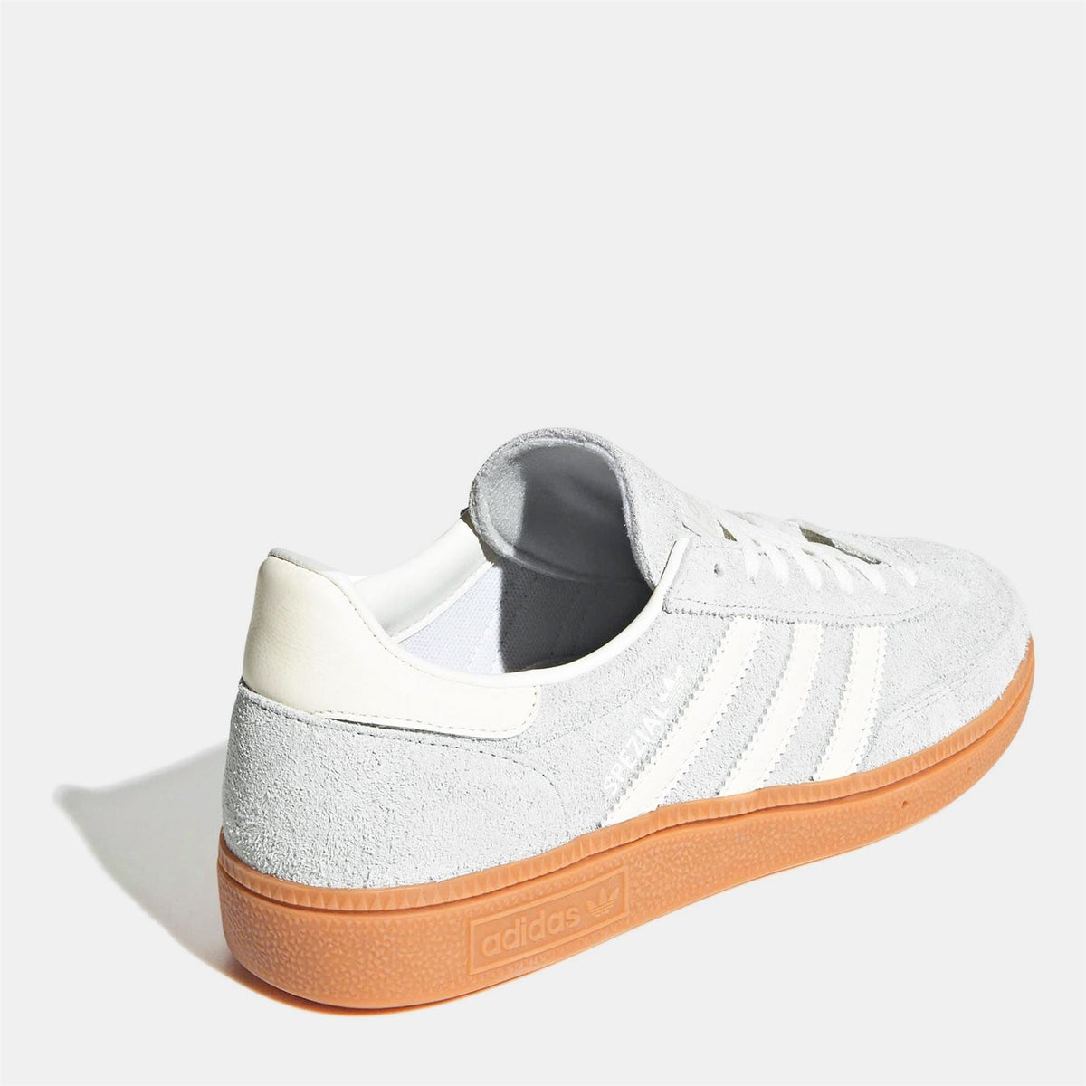 White suede low-top sneaker with heel tab and three stripe detailing