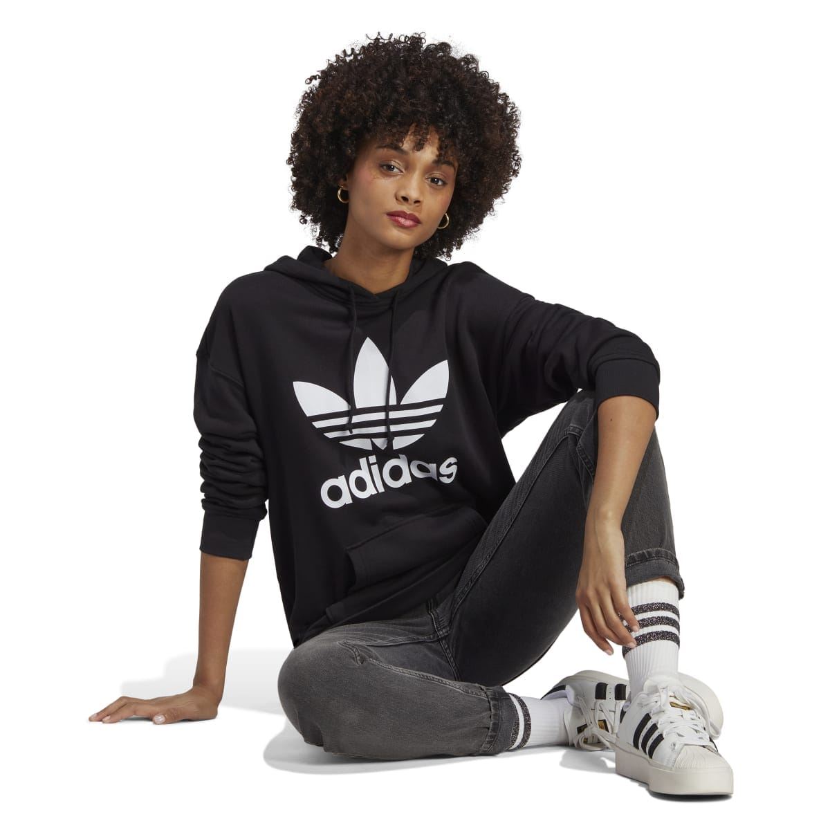 Black trefoil graphic hoody on model, adidas logo front and hooded neckline