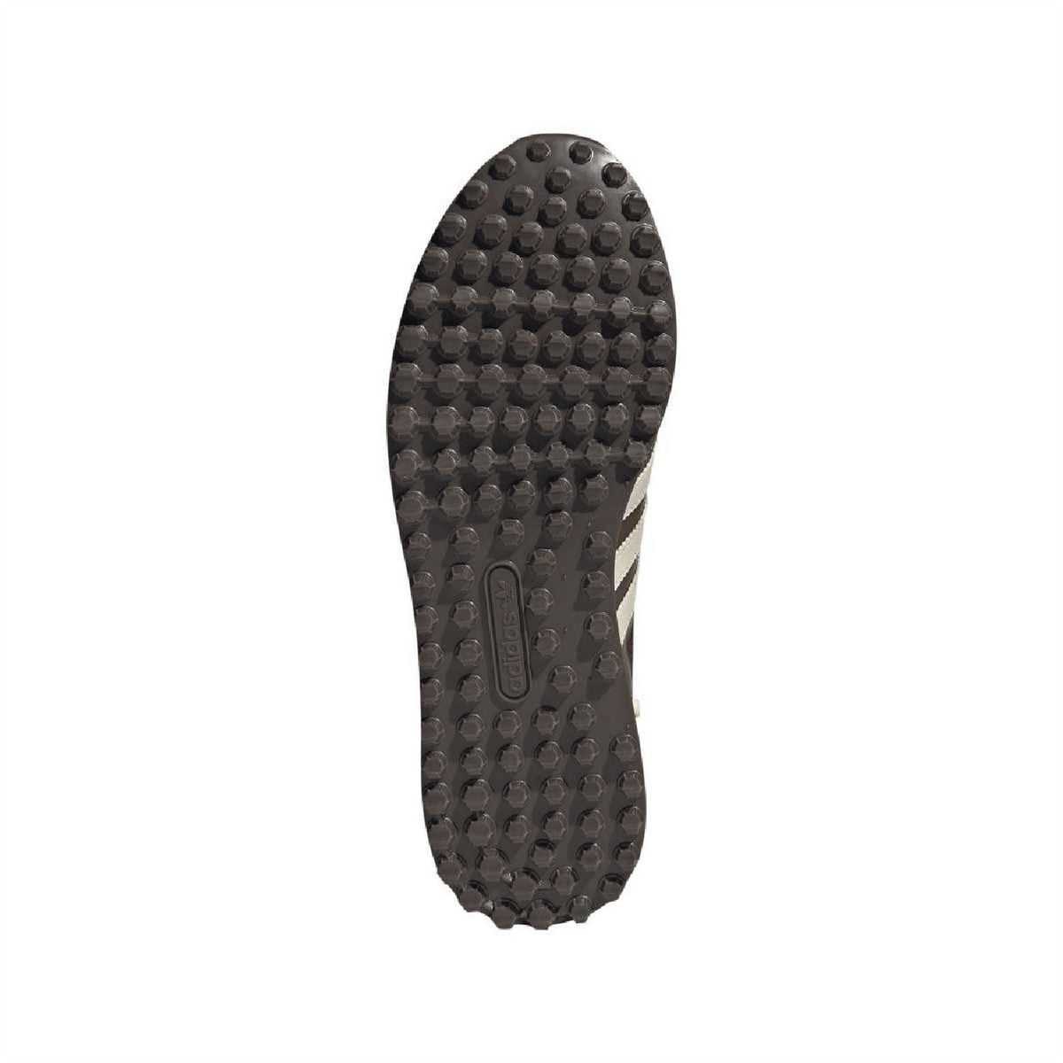 Rubber outsole for dark brown sneaker with textured traction studs