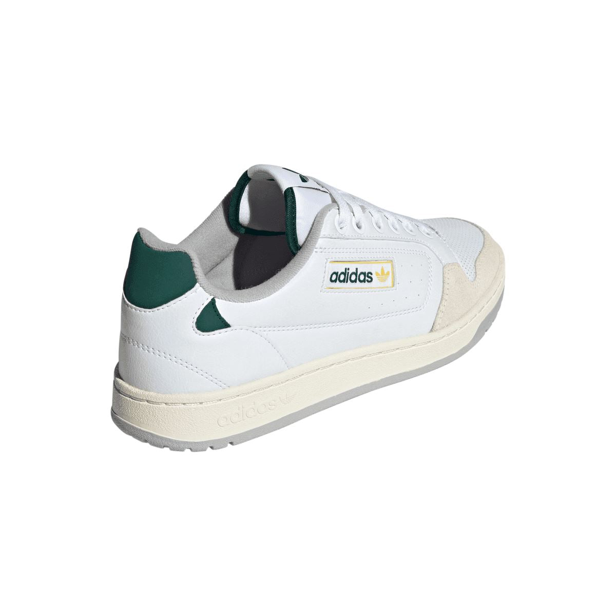 White adidas NY 90 trainers, heel side view with green collar and adidas logo badge