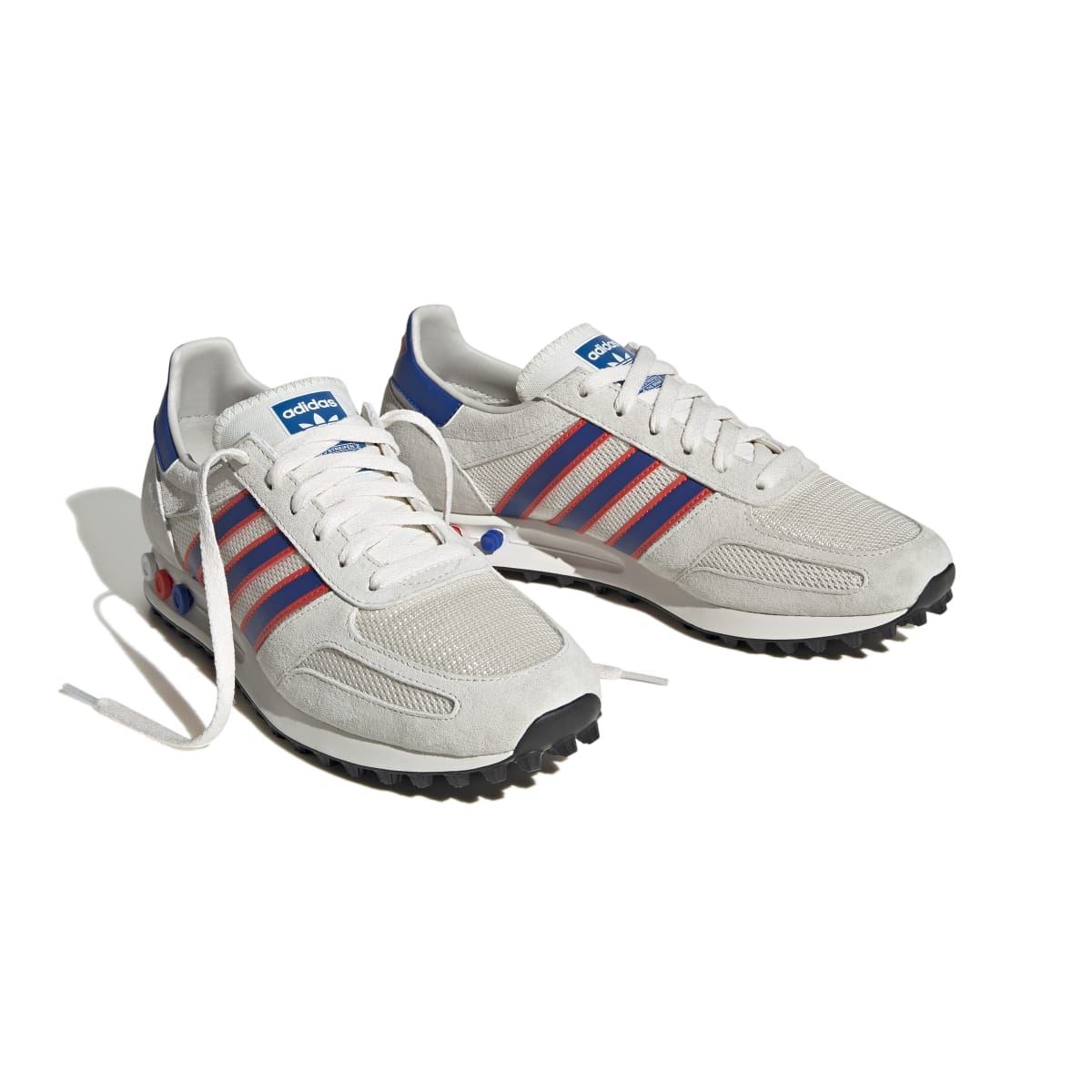 Pair of men's adidas Originals LA trainers with textured panels and blue heel tab
