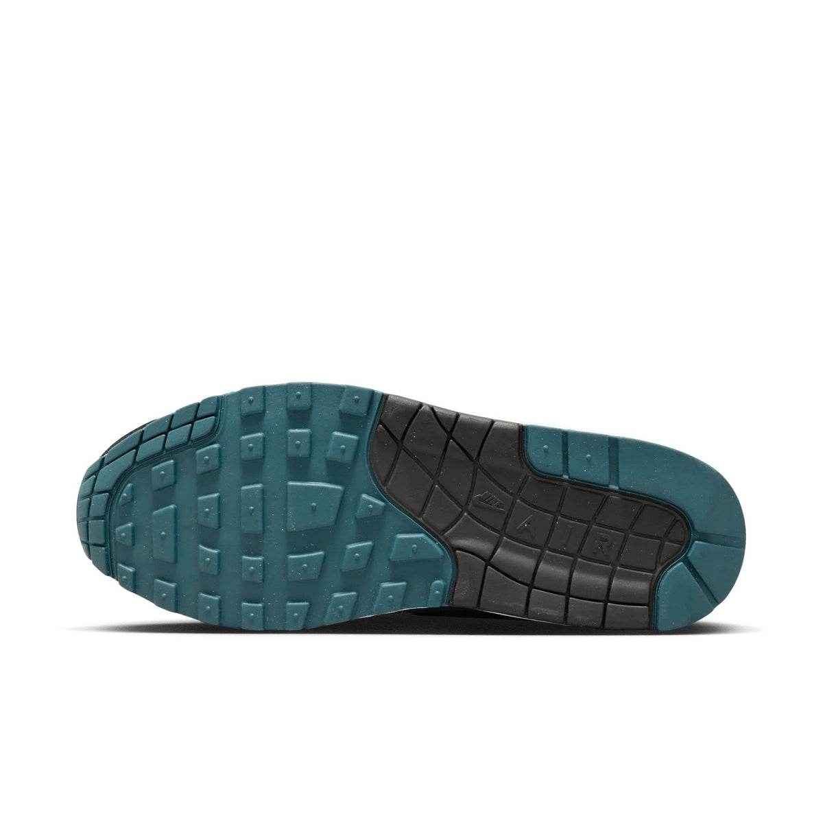 Shoe outsole with teal tread and black rubber sections for traction