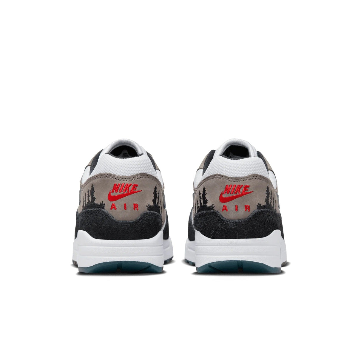 Back view of low-top sneakers with Nike Air branding, black heel, teal outsole