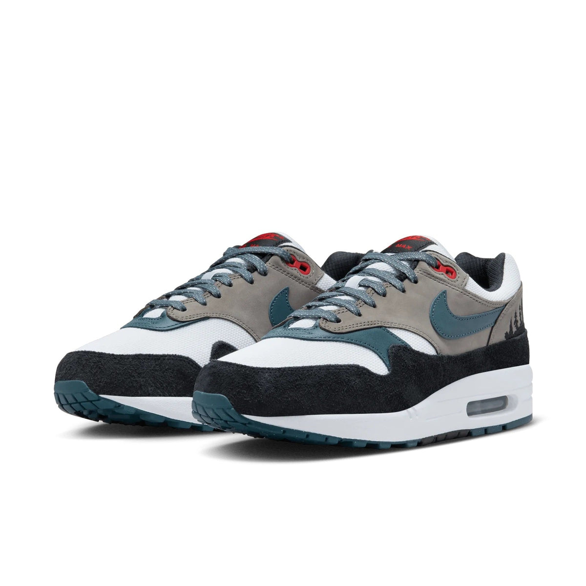 Pair of low-top sneakers with white panels, teal overlays, black heel, Air Max visible