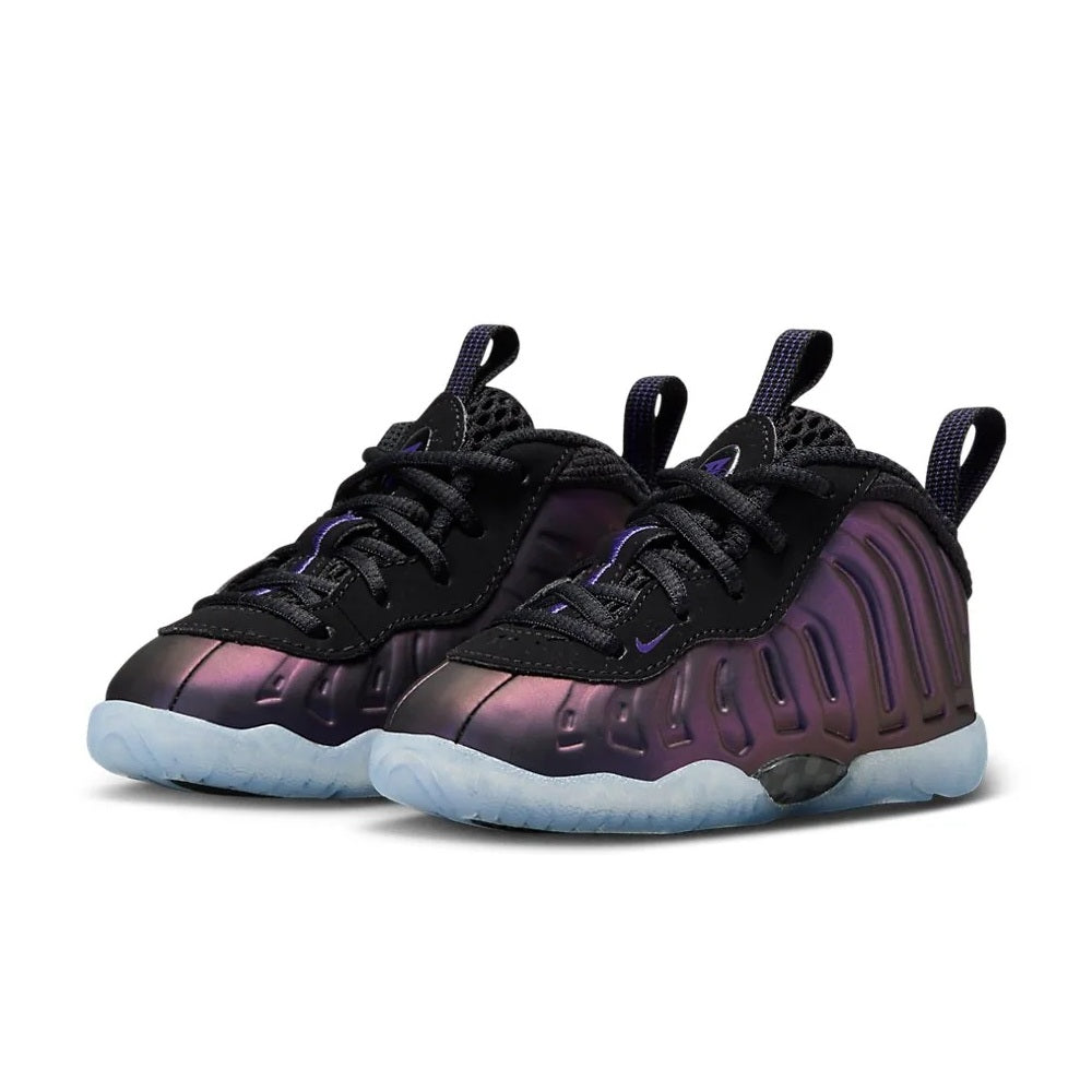 Toddler low-top sneakers with black laces, dark purple upper, and light blue sole