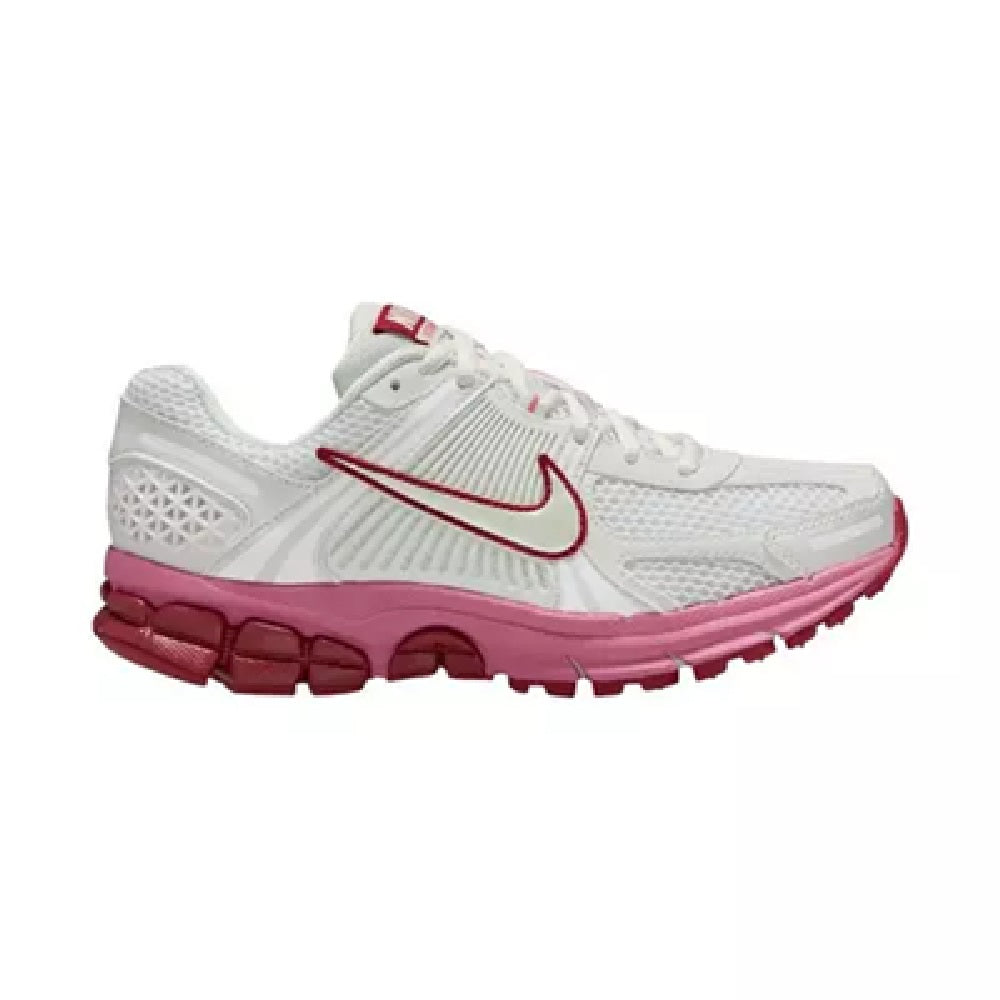 Women's Nike running shoe with white knit upper, red swoosh, and magenta outsole