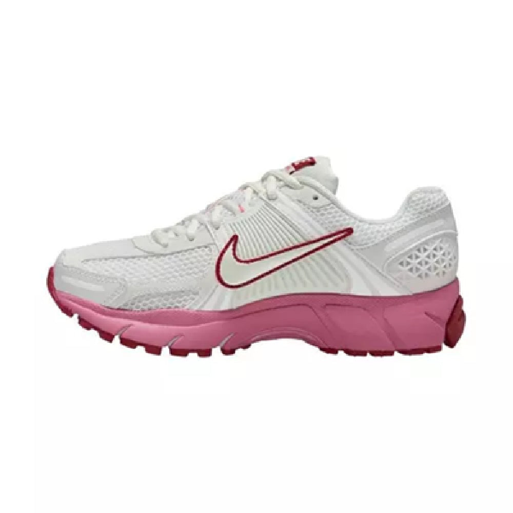Women's Nike running shoe, white mesh upper with red swoosh and magenta midsole