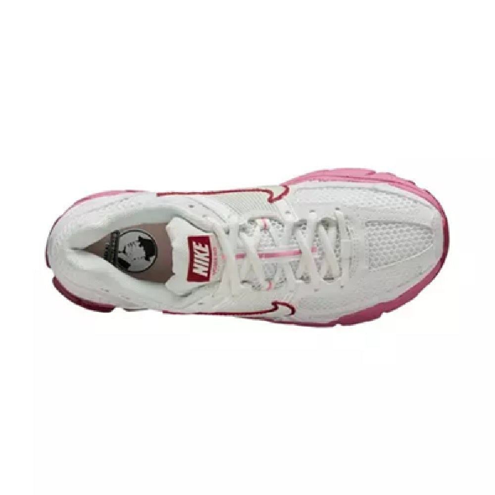 Women's Nike running shoe interior opening with white laces and red lining details