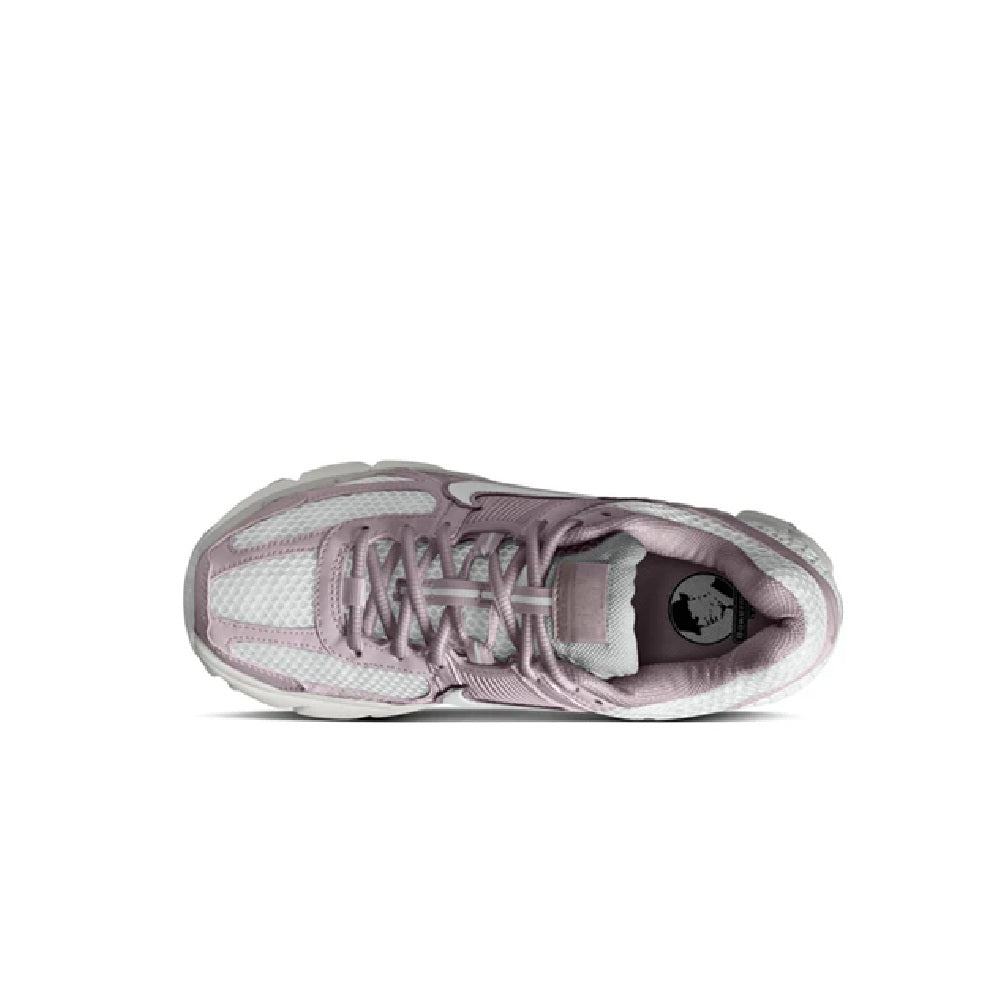 Nike Zoom Vomero 5 sneaker showing open tongue and lace-up closure, off-white and pink