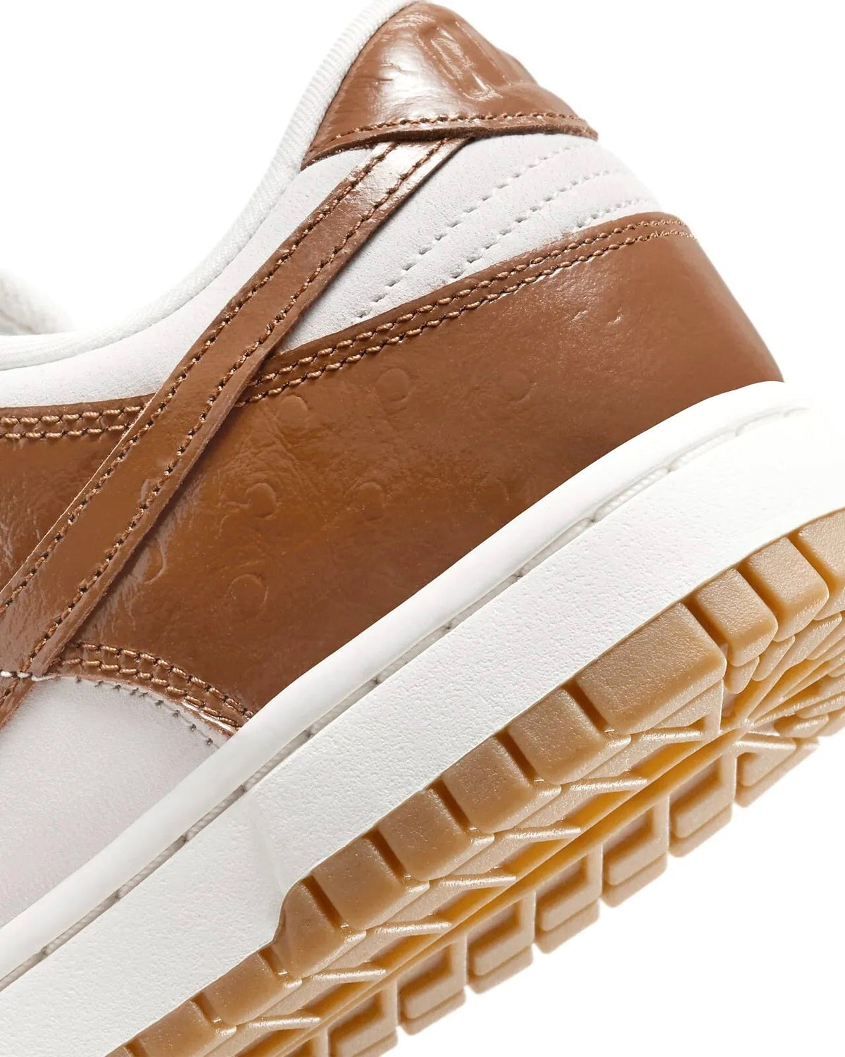 Women's Nike Dunk Low LX sneakers, toe and midsole detail in brown and white leather