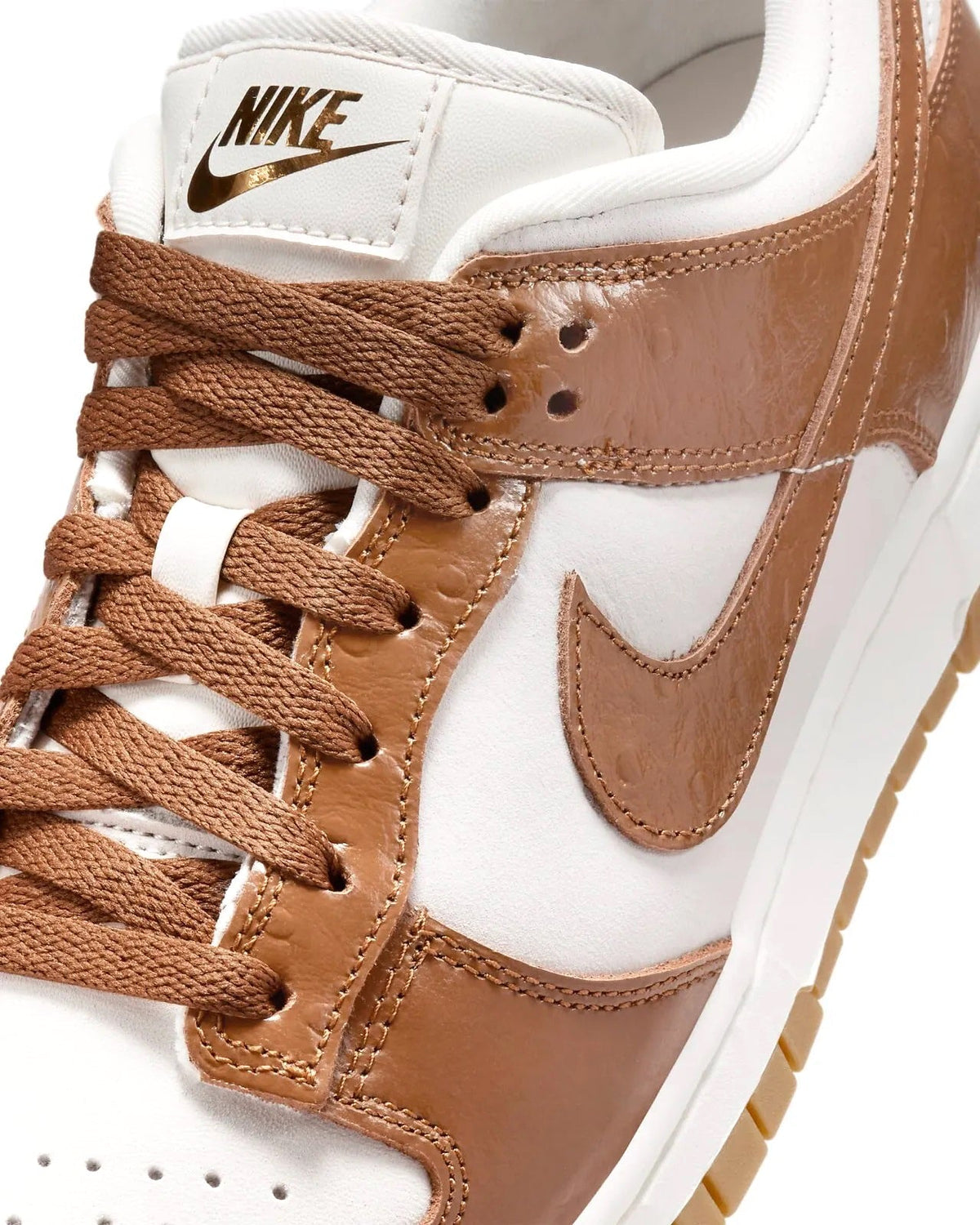 Women's Nike Dunk Low LX sneakers, lace and swoosh close-up in brown and white