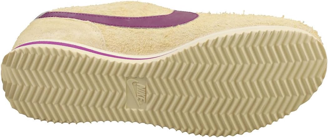 Women's Nike Cortez sneakers outsole, cream rubber sole with textured grooves.