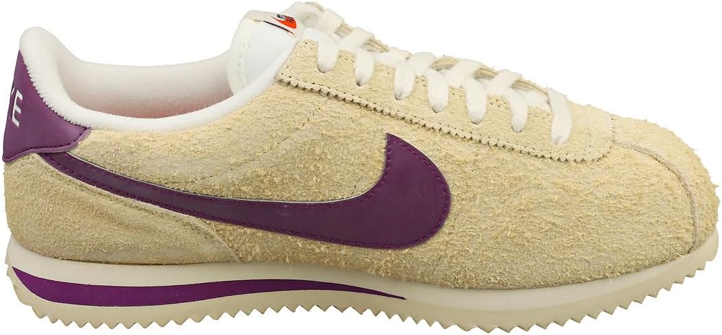 Women's Nike Cortez sneakers, tan suede with purple Swoosh and white laces.