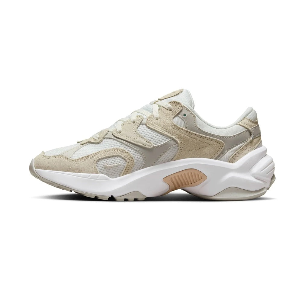 Nike women's running sneakers side view, light bone with tan overlays, white sole