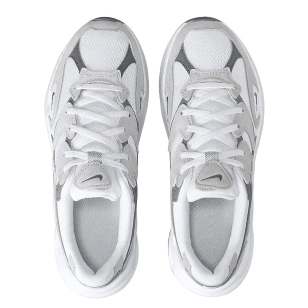Nike AL8 lace-up sneakers in white, front view with mesh panels and padded tongue.