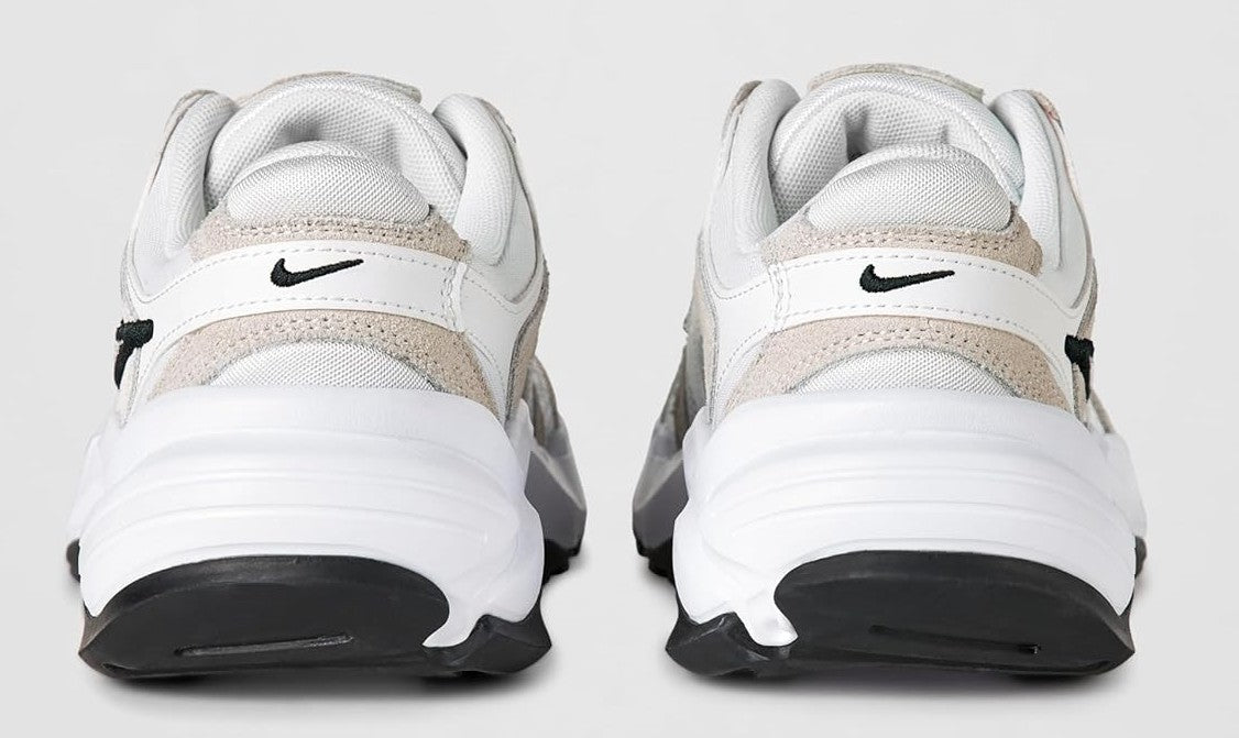 Women's Nike sneakers heel view, white mesh with beige panels and black logo