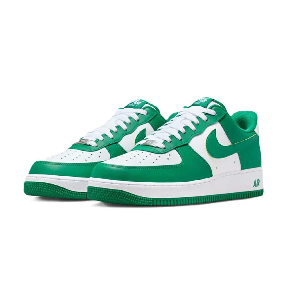 Nike Air Force 1 low sneakers pair, green and white leather with white laces