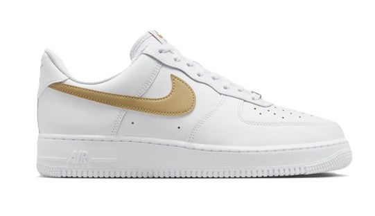 Nike low-top sneakers angled view, white leather with tan swoosh and lace holes