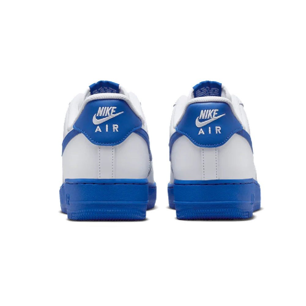 Nike Air Force 1 '07 sneakers, back view with blue heel tabs and white uppers.