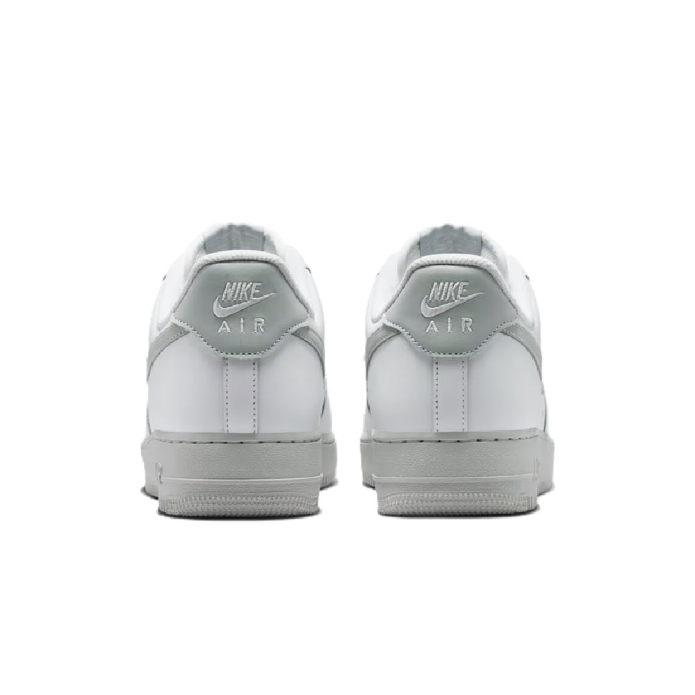 Nike Air sneaker heel view with white leather, gray lining, and 'AIR' branding