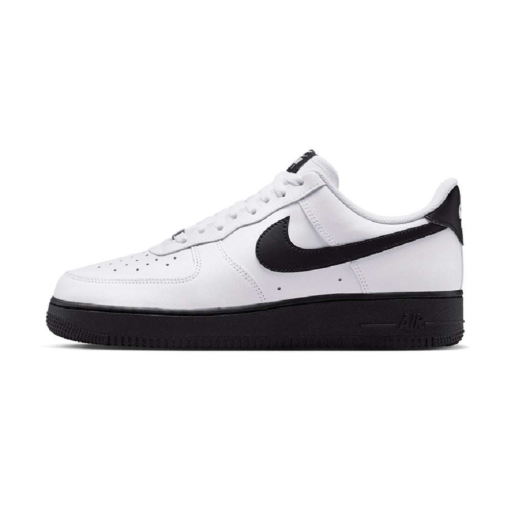 White low-top sneakers with black swoosh and black outsole; lace-up style.