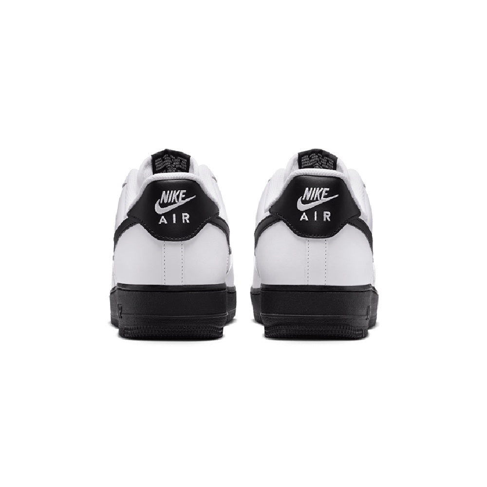 Back view of white low-top sneakers with black heel tabs and Nike Air branding.